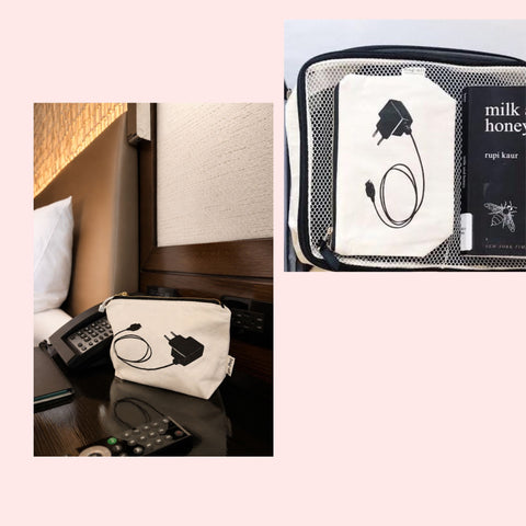 Small pouch with plug design on a desk next to a book and charger pouch next to hotel bedside