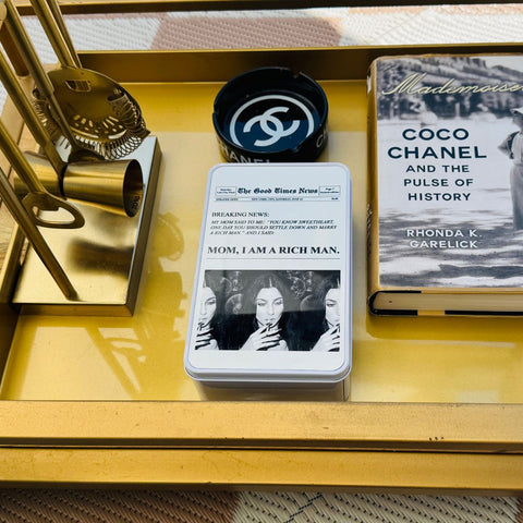 coffee table decor with newspaper graphic on tin box