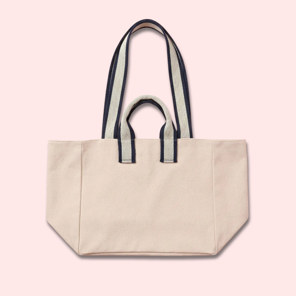 Custom canvas tote bag with name patch in off-white cotton and navy stripe handles