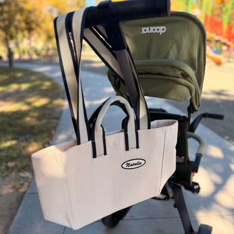 Everyday chic canvas tote bag with custom patch hanging on stroller – perfect for busy moms