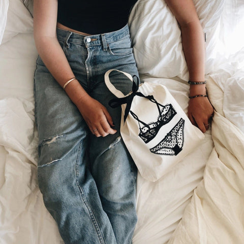 Girl holding a laundry lingerie bag 