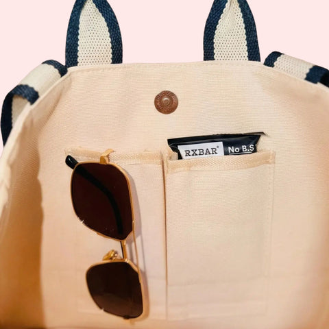 premium canvas tote bag with inside pockets and vintage striped handles