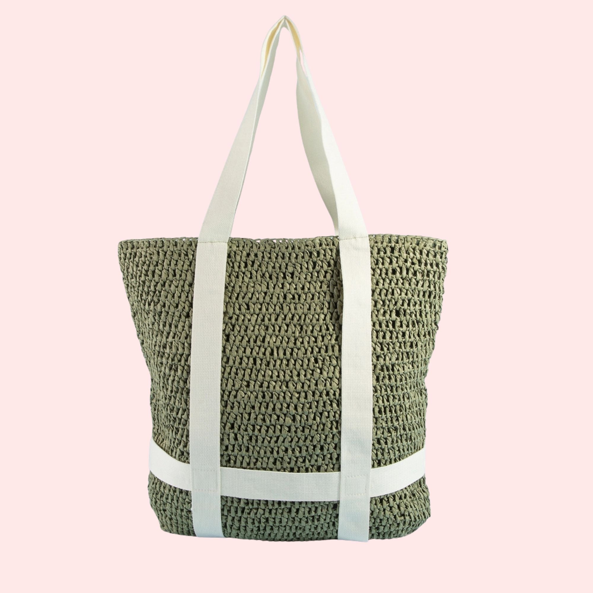 Woven tote bag with white straps on a pink background