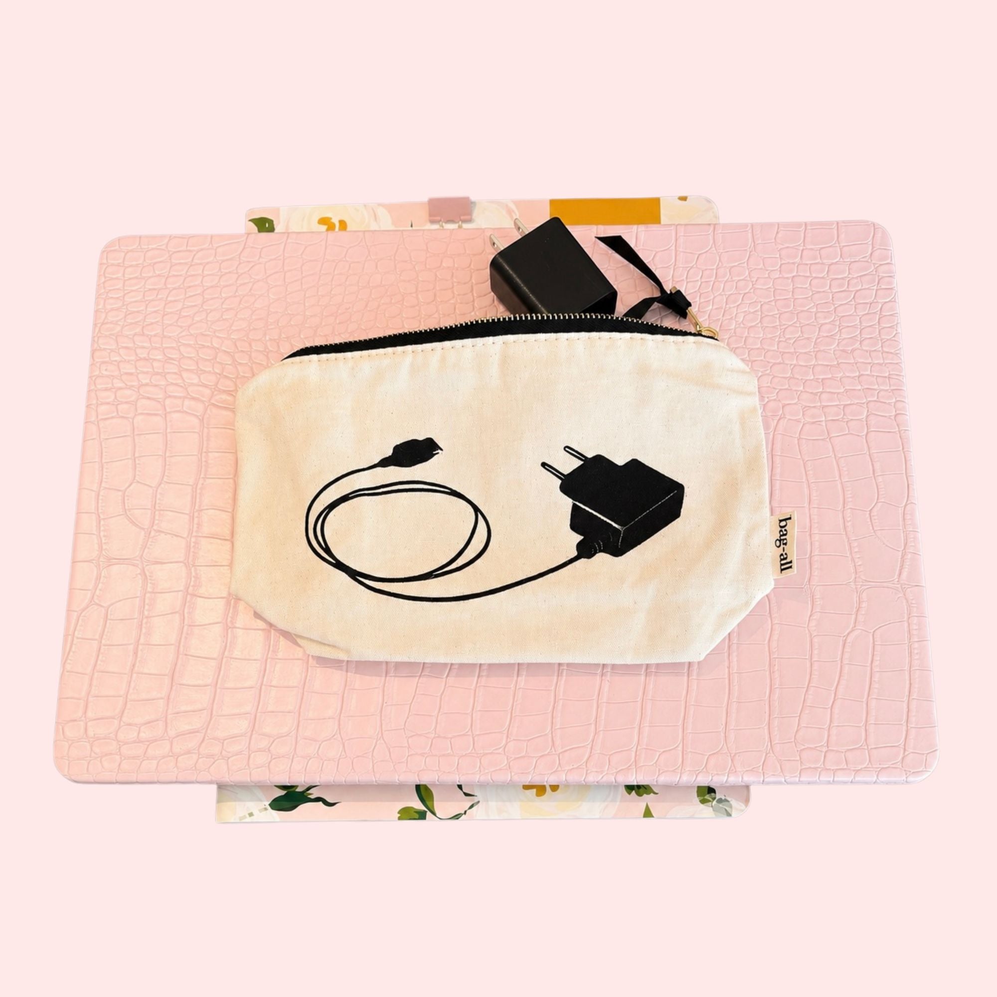 Small pouch with plug and cable design on a pink laptop and girly planner